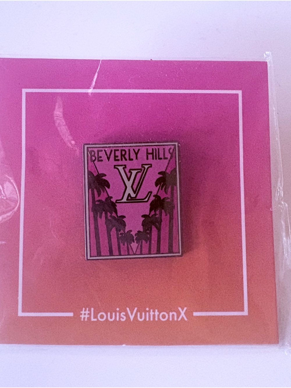 Louis Vuitton Black and Pink Logo Accent Pin